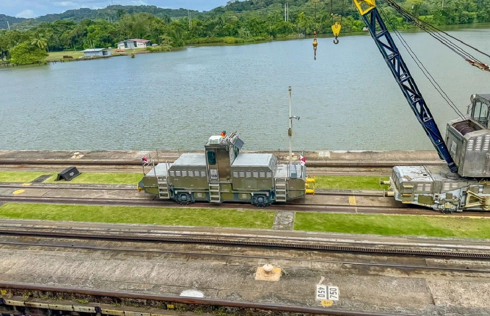 Electric mule pulling a ship during a cruise through the Panama Canal